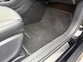 A black carpeted floor mat inscribed with the Mercedes-Benz logo inside a 2016 Mercedes-Benz GLA-250