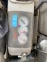 Control panel of a 2006 Komatsu PC55MR2 showing various gauges and indicator lights