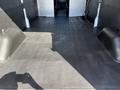 Interior of a 2022 Ford Transit van showing a spacious cargo area with a flat rubberized floor and no seats visible