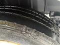 Close-up of a wet tire from a 2014 International TerraStar showing tread pattern and slight water droplets on the surface