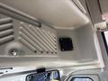 Interior view of a 2018 Chevrolet Express showing the ceiling with a textured finish and a small black vent panel