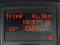 A digital display showing trip information with a distance of 41.6 km 139197 km total distance temperature of 23 degrees Celsius and the time 10:27