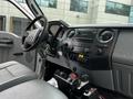 Interior view of a 2011 Ford F-550 showing the dashboard steering wheel and control buttons