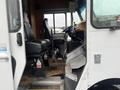 The image shows the interior of a 2012 Workhorse W62 featuring a driver's seat and dashboard with controls and pedals visible
