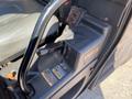 Close-up of the control console of a 2018 Kubota RTV-X 1100 C featuring a gear shift lever and various controls with visible warning labels