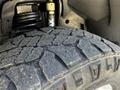 Close-up of a rugged tire tread from a 2022 RAM 3500 showing deep grooves and textured surface designed for off-road traction