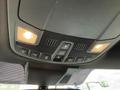 Interior overhead console of a 2019 Ford F-150 featuring lights and various control buttons