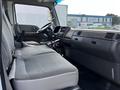 Interior view of a 2009 Ford LCF 550 showing the driver's seat and dashboard with gray upholstery and control features