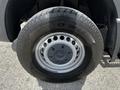 Front tire of a 2017 Mercedes-Benz Sprinter showing a Toyo WLT1 tire with a silver wheel hub and a distinct tread pattern