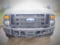 Front view of a 2008 Ford F-550 featuring a black grille with the Ford logo and orange headlights