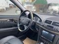 Interior view of a 2007 Mercedes-Benz E-Class showing the steering wheel dashboard and center console