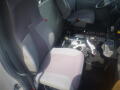 Interior of a 2016 International WorkStar 7500 featuring driver and passenger seats along with various control panels and equipment on the floor