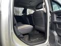 Interior view of the backseat area of a 2012 RAM 3500 with gray upholstery and floor mats