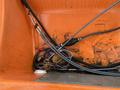 A compartment filled with tangled wires and cables in a 2008 Fassmer 20 Foot Fast Rescue boat