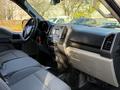Interior view of a 2018 Ford F-150 showing front seats dashboard and controls