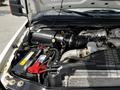 Engine compartment of a 2009 Ford F-550 featuring the engine block battery and various components