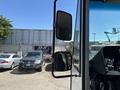 A 2019 Freightliner MT45 cargo truck with a side mirror and part of the driver's cabin visible in the foreground