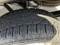 Close-up of a tire from a 2022 Ford Transit showing tread pattern and wear.