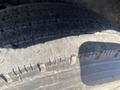 Close-up of a tire from a 2024 Southland 18 Foot Dump Trailer showing tread patterns and wear on the surface