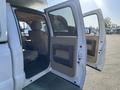 A 2014 Ford F-350 SD with open front doors revealing the interior and seats