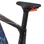 A close-up of a Canyon Roadlite:ONfly CF MACH874 road bike seat and post with an integrated red rear light mounted on the back
