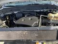 The image shows a 2013 Ford F-250 SD engine with various components including air intake and fluid reservoirs visible