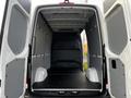 Interior of a 2022 Mercedes-Benz Sprinter cargo van showing a spacious empty cargo area with gray walls and a flat black floor