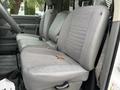 Interior view of a 2008 Sterling Bullet showing gray fabric seats with a center console and seat belts