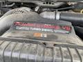 Detail of a 2007 Ford F-350 SD engine showing the Power Stroke V8 Turbo Diesel badge on the engine cover