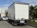 A white 2014 Hino 195 box truck parked with a plain cargo area and visible rear lights and license plate