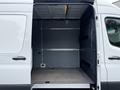 A 2019 Mercedes-Benz Sprinter with an open side door revealing a spacious and empty cargo area