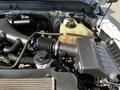 Engine compartment of a 2016 Ford F-550 showcasing the air intake system coolant reservoir and various engine components
