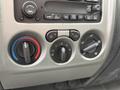 Control panel of a 2012 GMC Canyon featuring knobs for temperature and air distribution settings