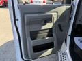 2015 Ford Econoline door panel featuring a grey interior design with a handle speaker grille and storage compartments