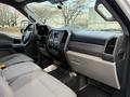 Interior view of a 2017 Ford F-450 Super Duty featuring gray cloth seats and a modern dashboard with controls and a touchscreen display