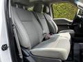 Interior view of a 2017 Ford F-250 SD showing gray cloth front seats with seatbelts and armrests