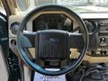 Interior view of a 2008 Ford F-550 steering wheel with Ford logo and dashboard gauges visible