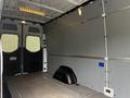 A 2019 Mercedes-Benz Sprinter van interior featuring a spacious cargo area with gray walls and a smooth flooring surface