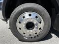 Close-up of a shiny chrome wheel on a 2015 RAM 5500 showing lug nuts and tire specifications