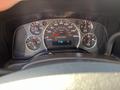 Dashboard of a 2014 Chevrolet Express showing speedometer fuel gauge and other indicator lights