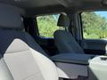 Interior of a 2017 Ford F-350 SD with gray fabric seats and a center console between the front seats