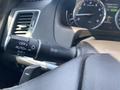 A close-up view of the control stalk in a 2017 Acura TLX featuring switches for headlights and turn signals
