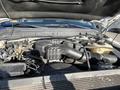 The image shows the engine compartment of a 2014 Ford F-350 SD with various components including a large air intake system and hoses visible