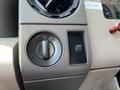Close-up of controls on the dashboard of a 2008 Ford F-450 SD including a dial and a toggle switch for various functions
