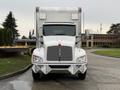 A white 2017 Kenworth T370 truck with a boxy cargo area and chrome accents is parked facing the viewer