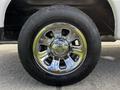 A close-up view of a chrome wheel rim mounted on a tire from a 2010 Ford Ranger