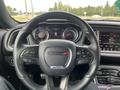 Interior view of a 2017 Dodge Challenger showing the steering wheel and dashboard controls