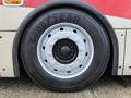 Close-up of a Goodyear tire mounted on a 2016 Grande West Vicinity bus showing the wheel's silver and black design
