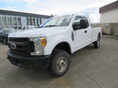 A white 2017 Ford F-250 SD pickup truck with a single cab and a short bed viewed from the front angle