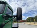 A green 2013 Kenworth T370 truck with a prominent side mirror is shown in the foreground